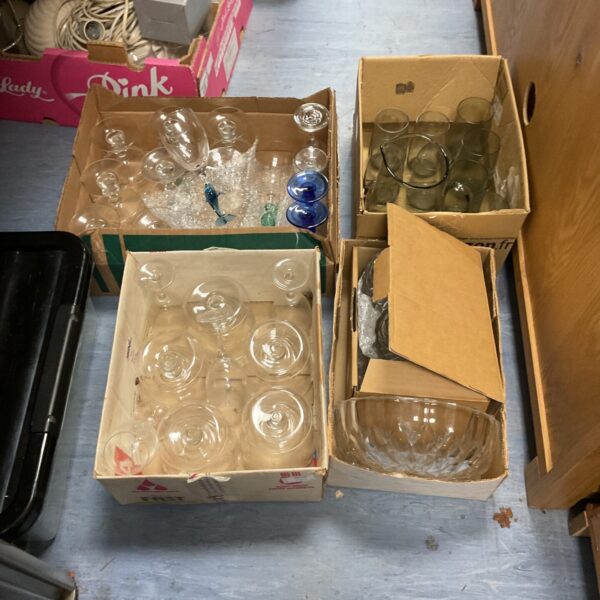 Mixed glassware lot with cut glass and assorted drinking glasses.