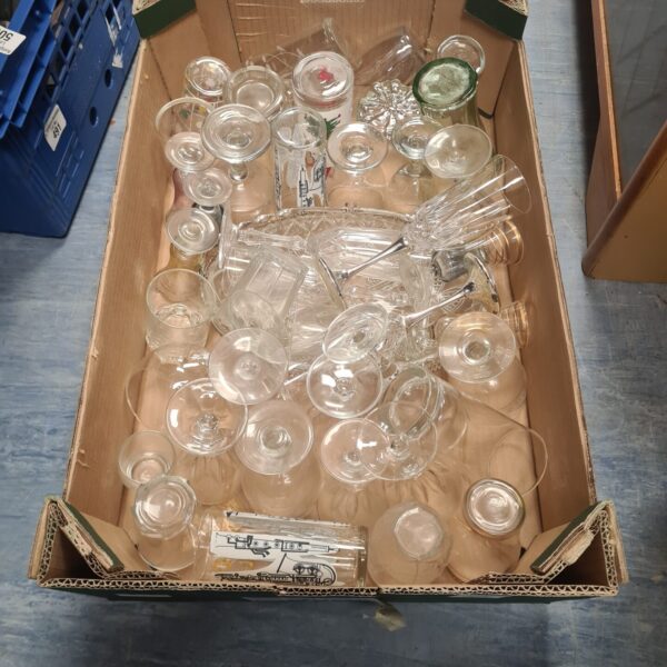 Assorted mixed glassware lot with various tumblers and wine glasses.