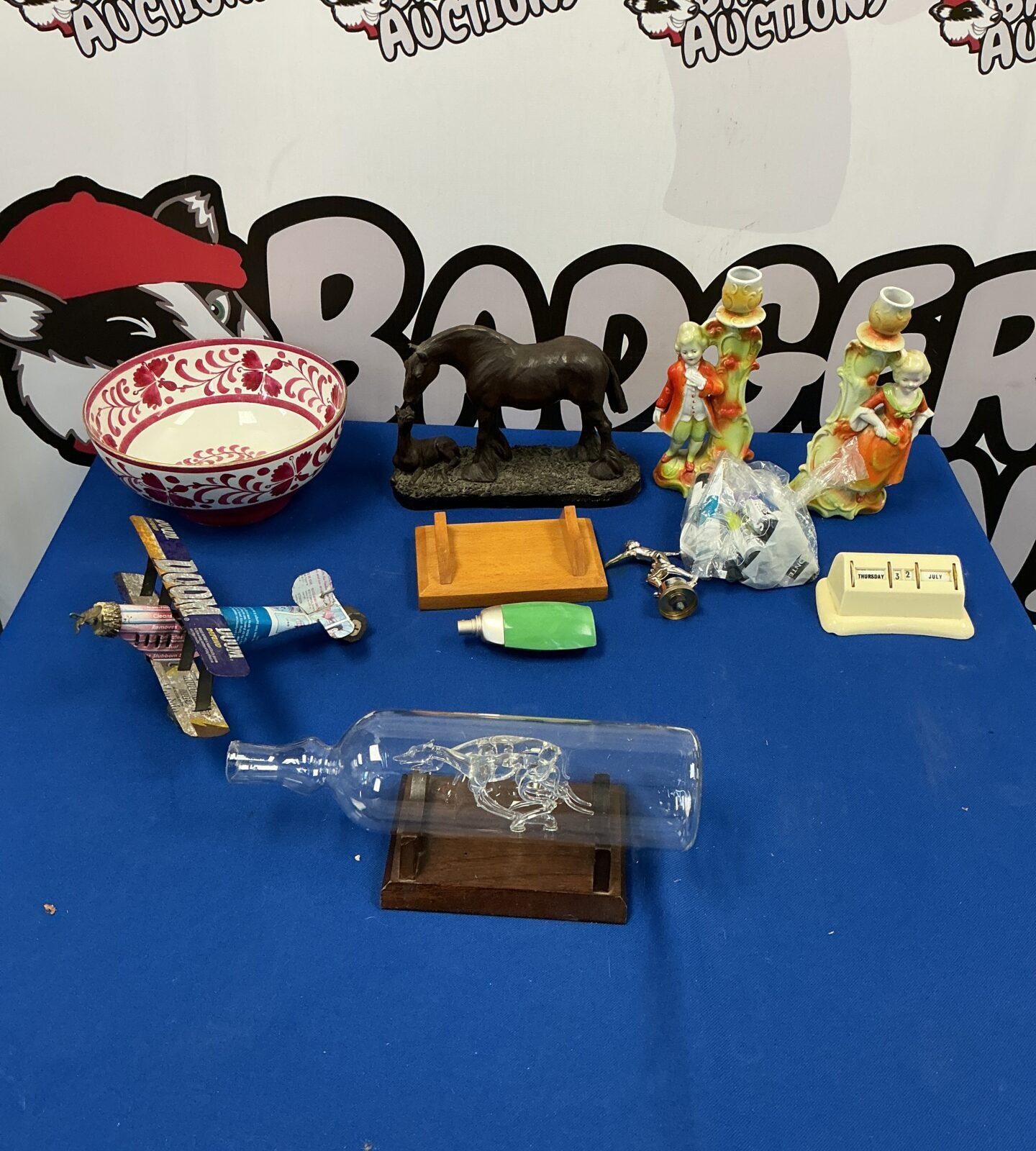 Mixed lot of vintage collectibles including Greyhound figurines and a floral plate.