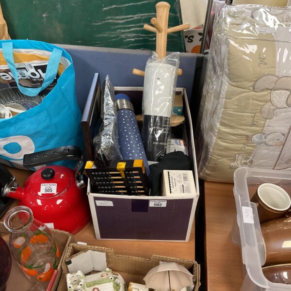 Mixed lot of vintage flasks and collectibles on display.