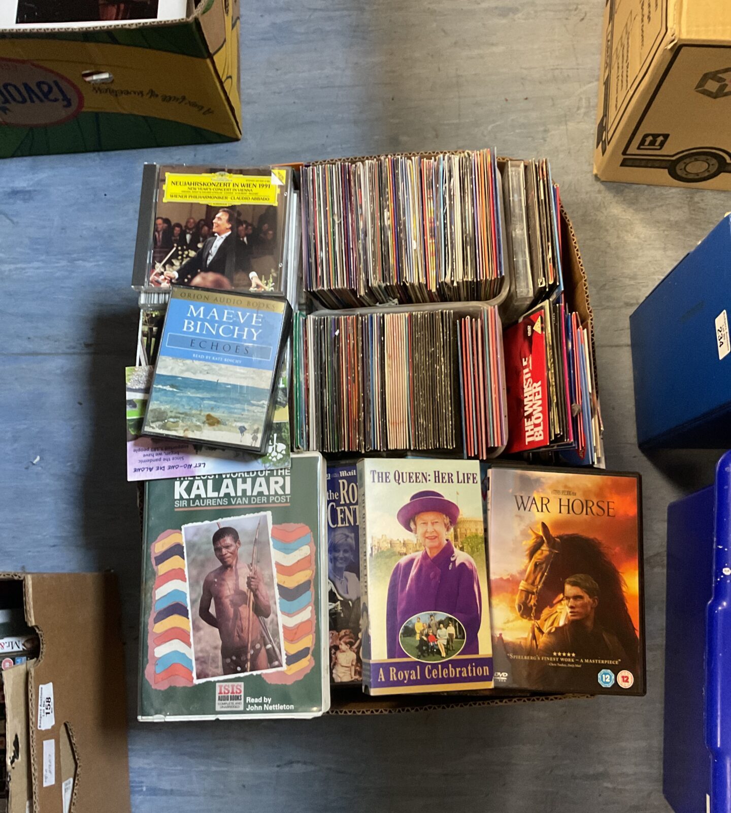 Large mixed media collection of VHS tapes, CDs, and DVDs for sale.