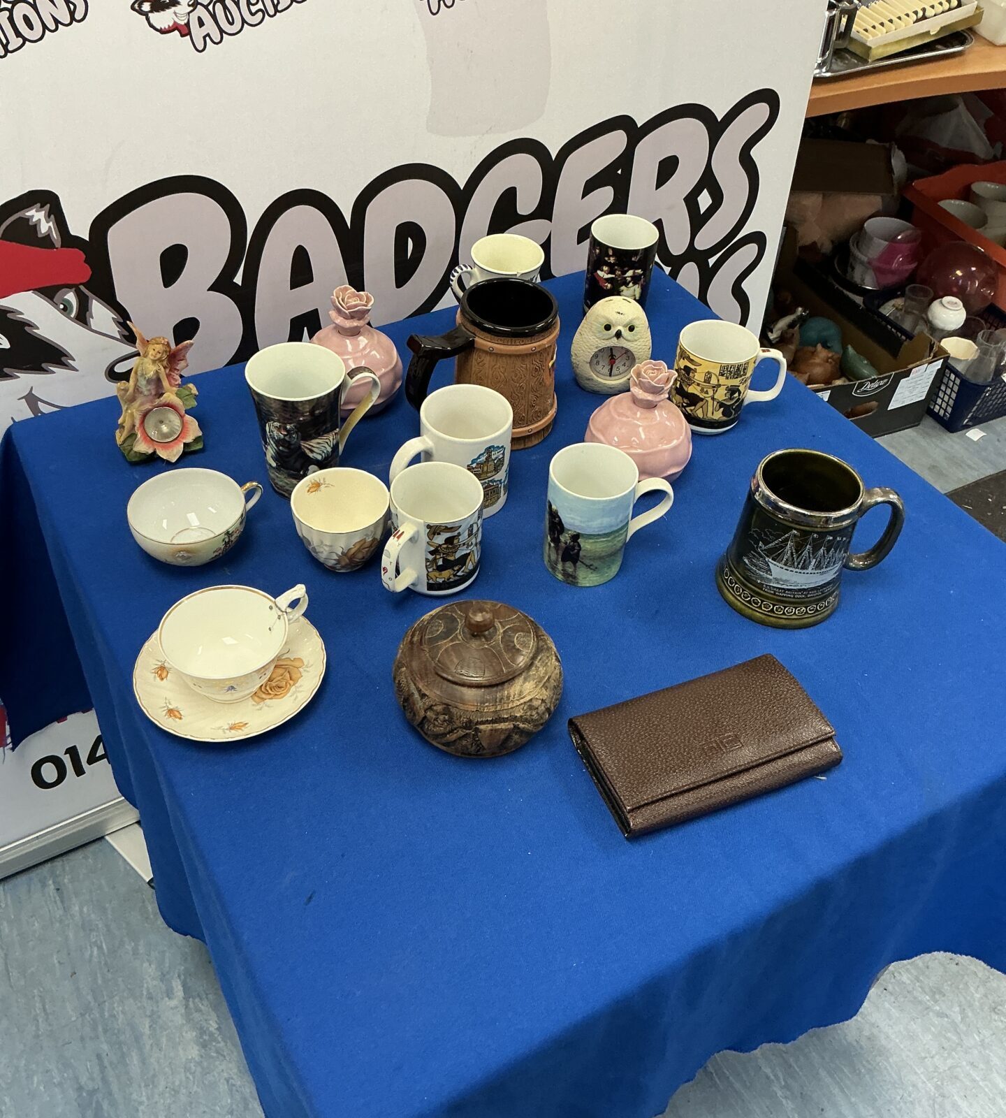 Mixed collection of vintage ceramic mugs and vases for home decor.