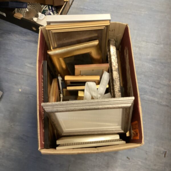 Mixed lot of vintage and assorted picture frames for wall decor.