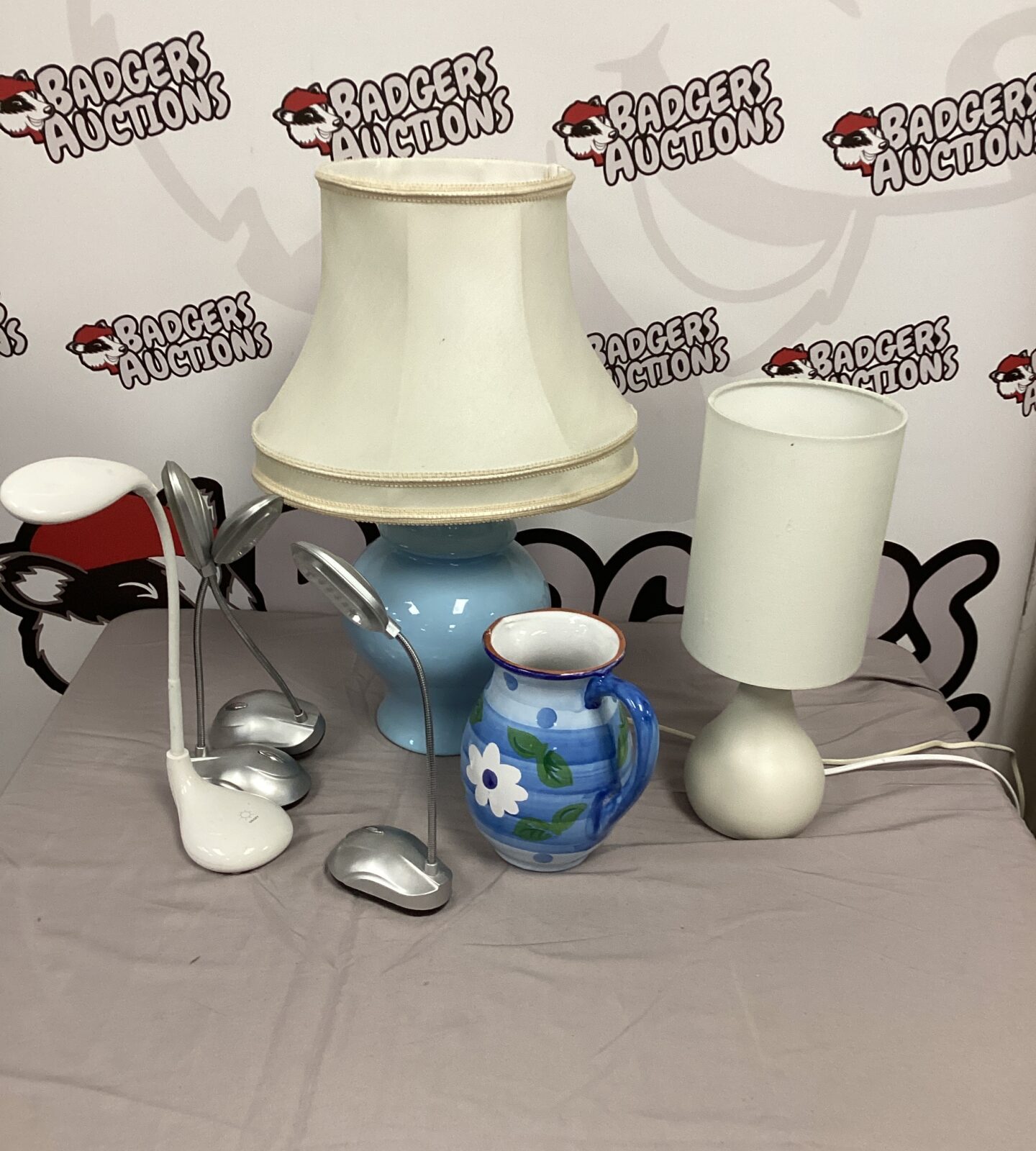 Mixed collection of vintage and modern table lamps for sale.