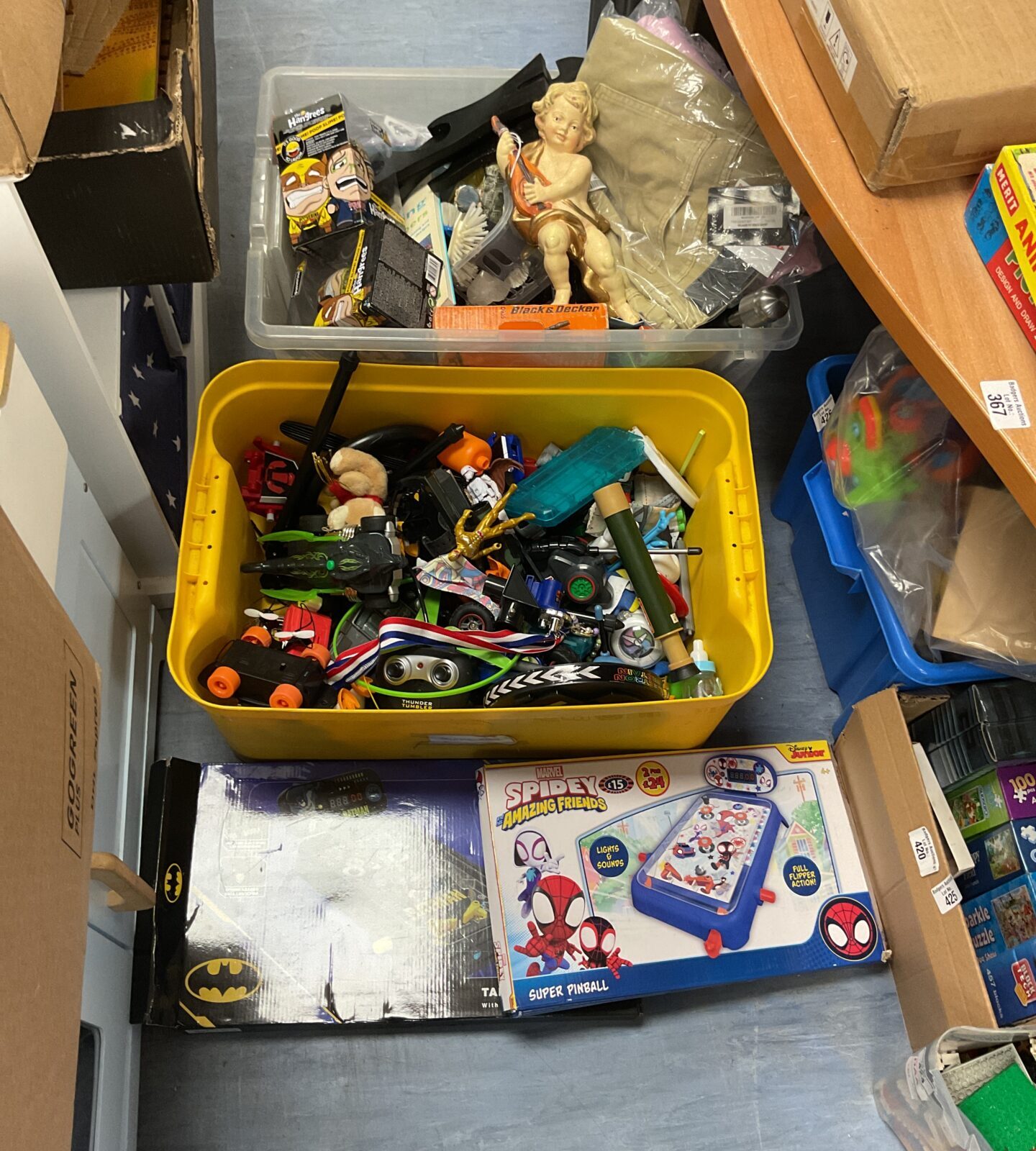 Overview of a mixed toy lot with clothing items.