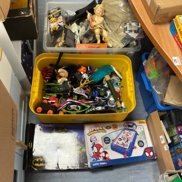 Overview of a mixed toy lot with clothing items.