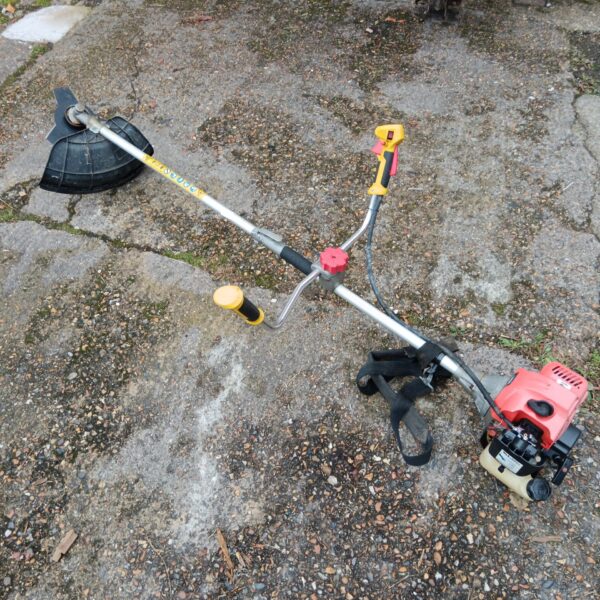 Used Mk petrol garden strimmer for lawn and grass trimming.