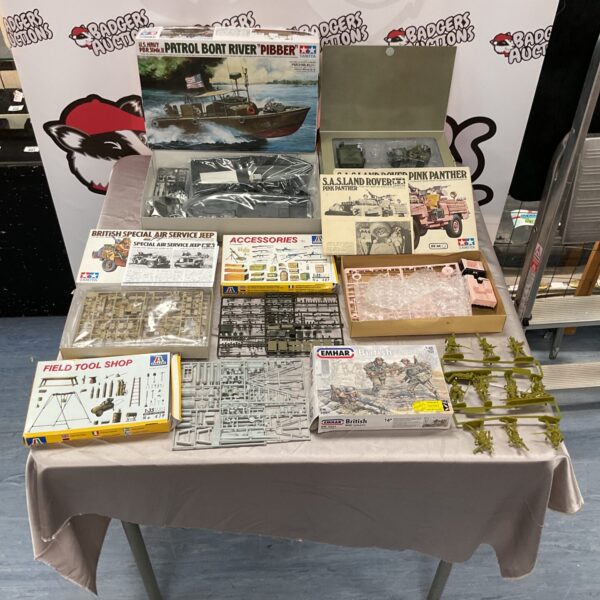 Assorted model kits including Tamiya and a Jeep Willys RC model.