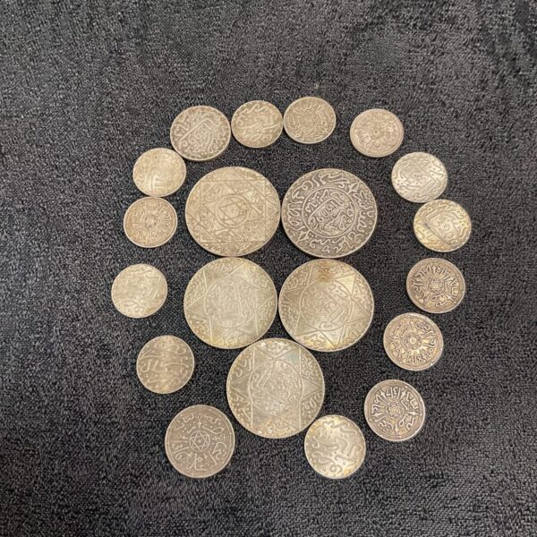 Moroccan silver dirham coin collection from the 19th century.