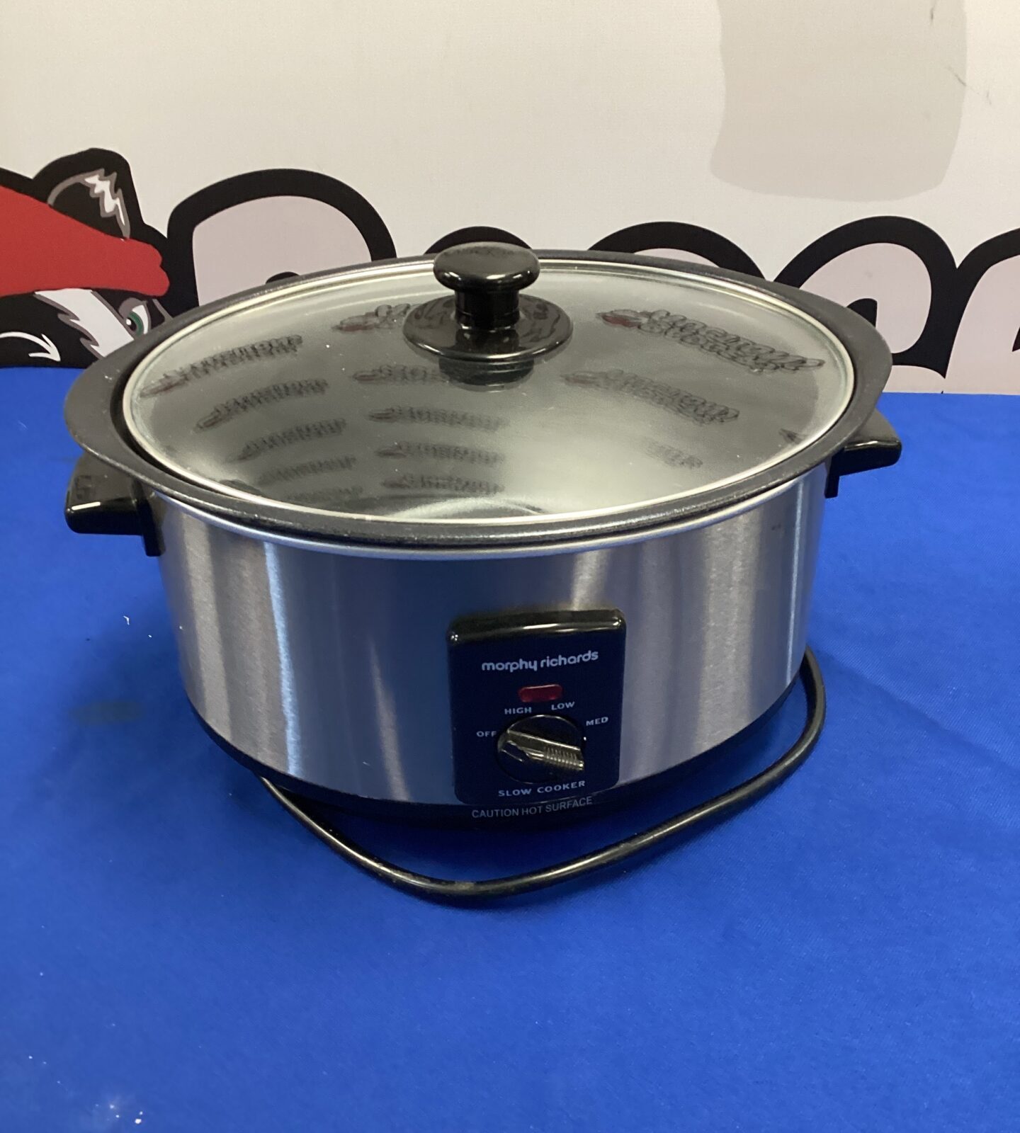 Front view of a small Morphy Richards slow cooker with lid.