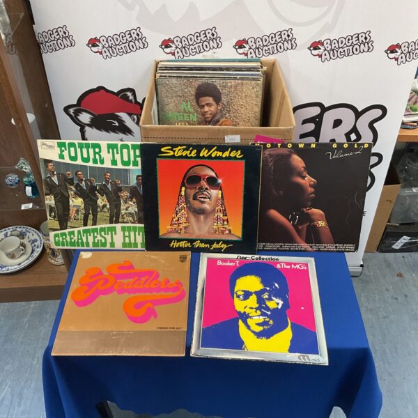 Vintage Motown LP collection with Stevie Wonder record visible.