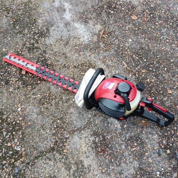 Mountfield petrol hedge cutter for garden hedge maintenance.