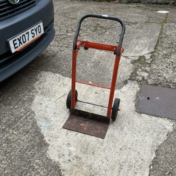 Folding multi-purpose trolley for moving heavy loads.