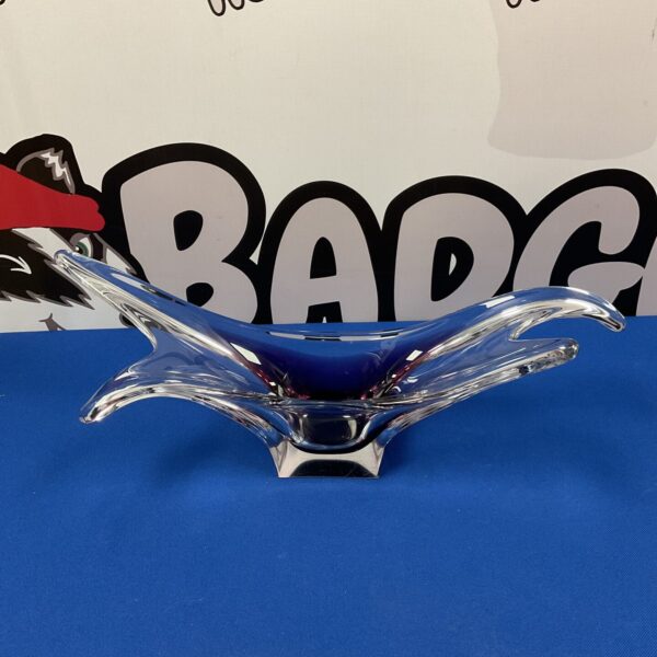 Vibrant purple and clear Murano glass bowl for display.