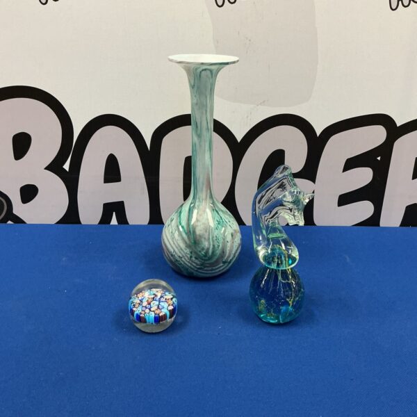 Vibrant green Murano glass vase with swirling patterns.