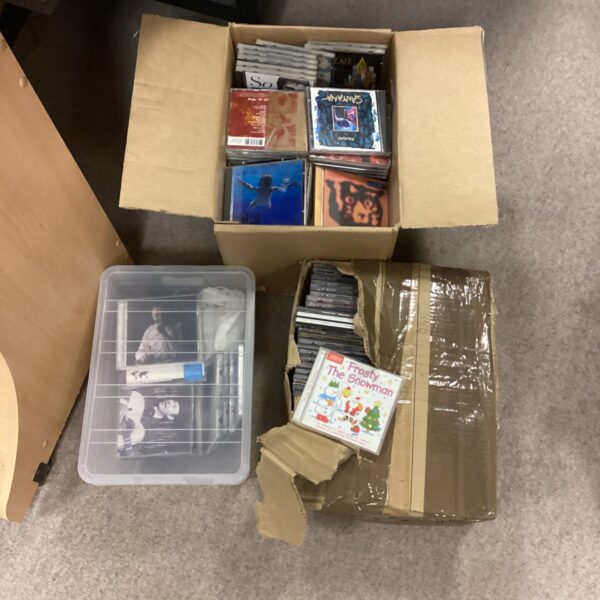 Stack of three boxes containing a music CD lot.