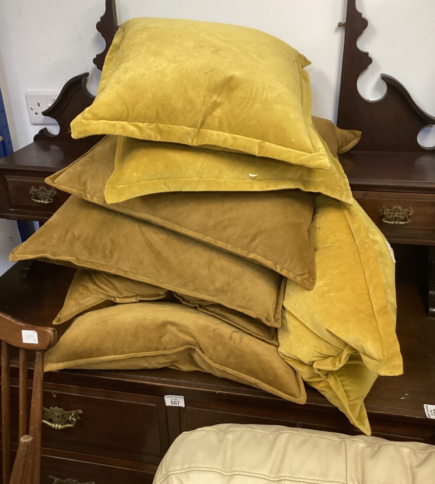 Lot of seven mustard coloured sofa cushions for home decor.