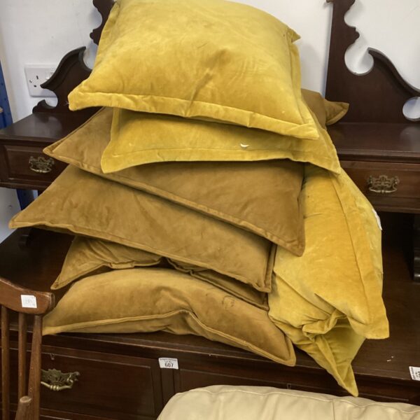 Lot of seven mustard coloured sofa cushions for home decor.