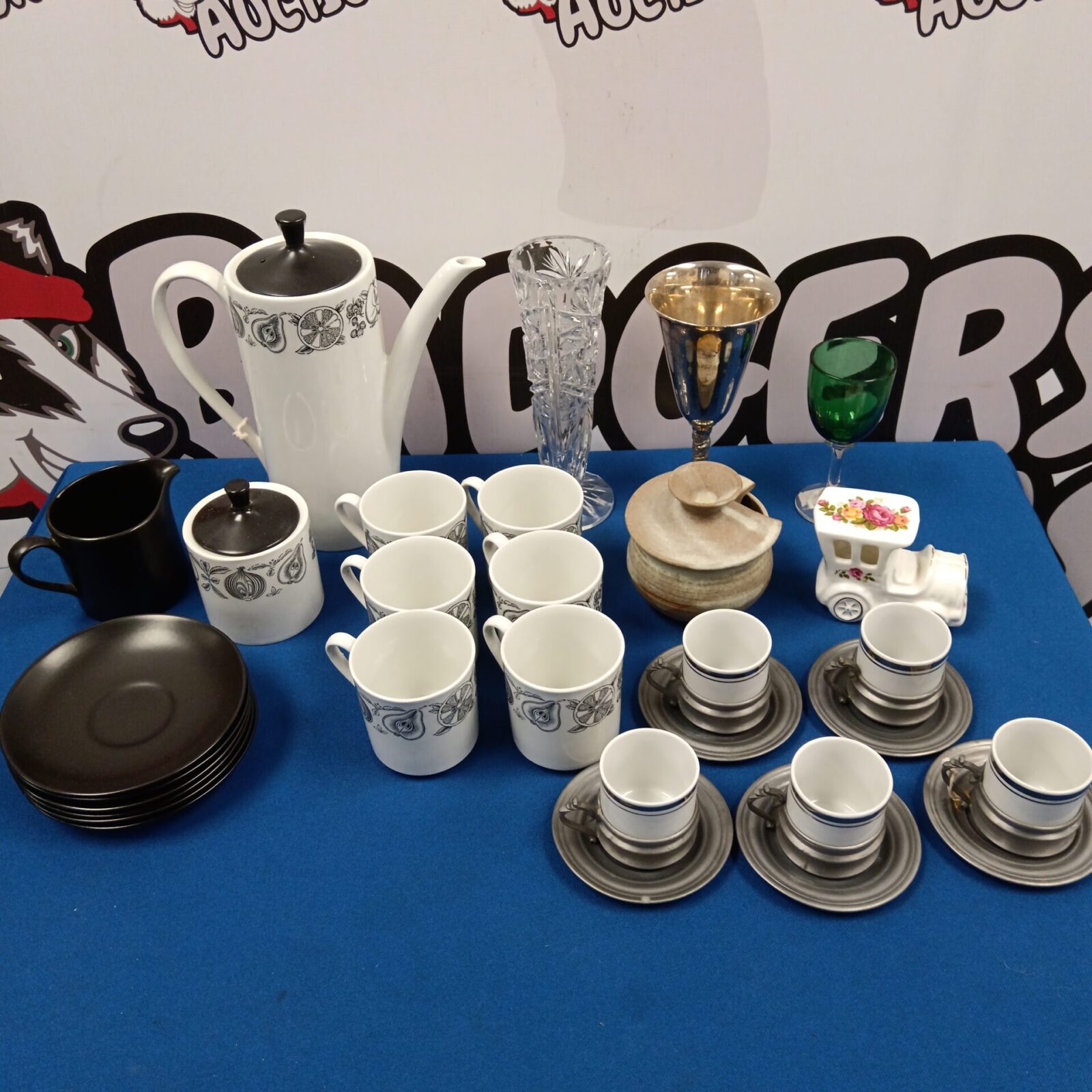 Vintage Myotts Staffordshire coffee set with cups and saucers displayed.