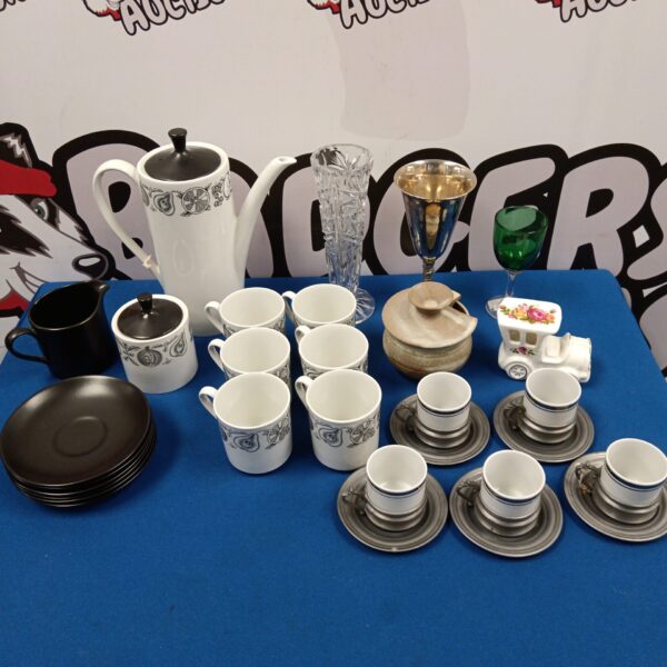 Vintage Myotts Staffordshire coffee set with cups and saucers displayed.