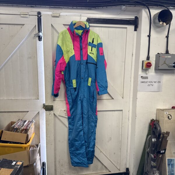 Vintage Nevica ski suit with Recco avalanche alarm, front view.