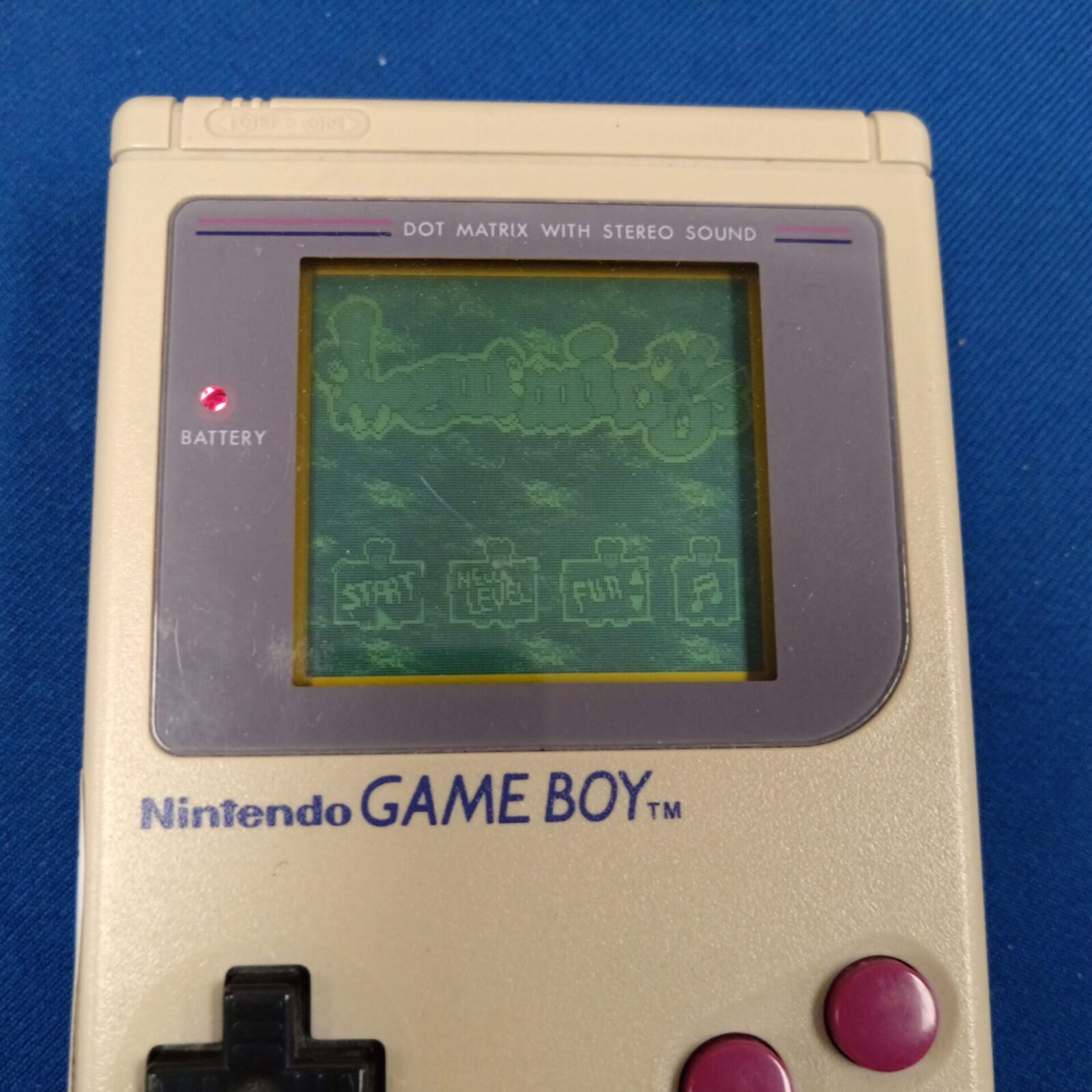 Close-up of Nintendo Game Boy DMG-01 console and game.