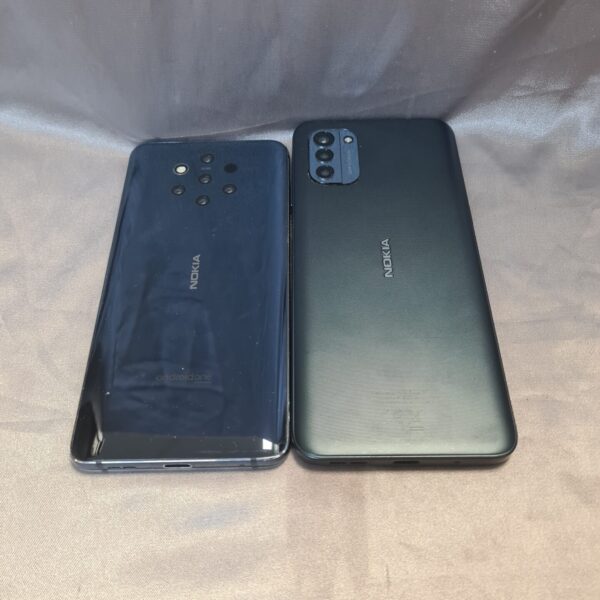 Two Nokia mobile phones displayed against a grey background.