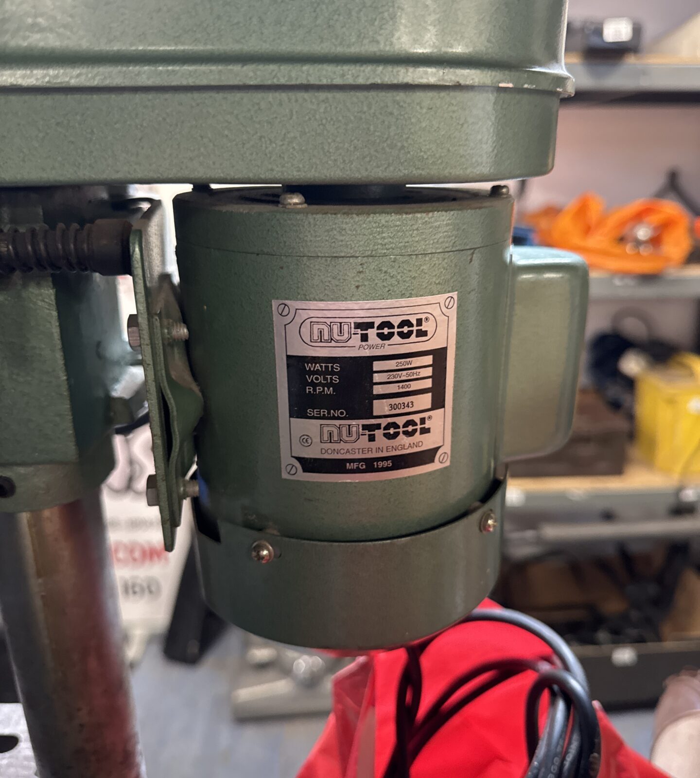 Close-up of the Nutool drill motor with power details.