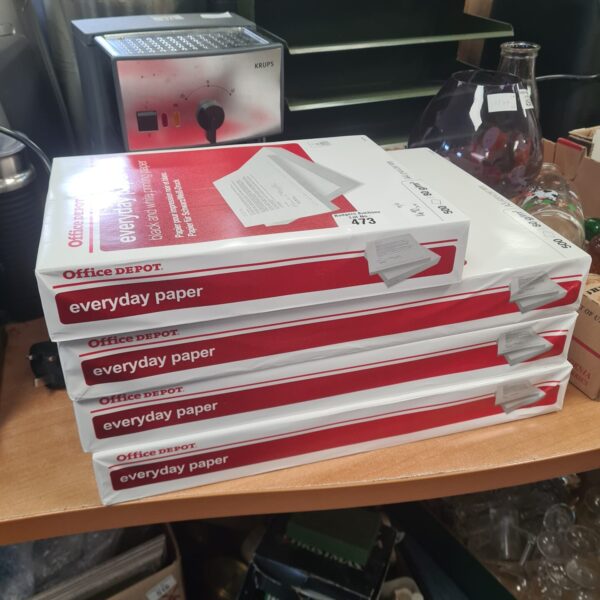 Stack of new Office Depot Everyday Paper reams, ready for printing.