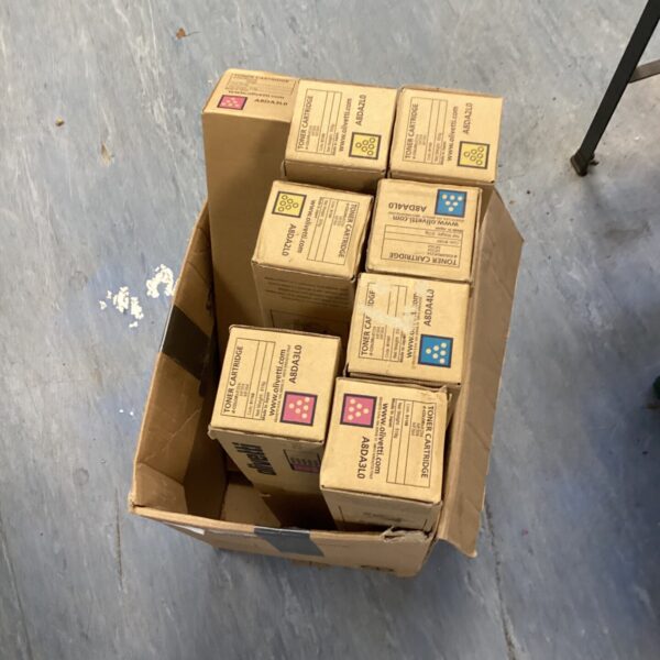 Lot of Olivetti printer toner cartridges for office use.