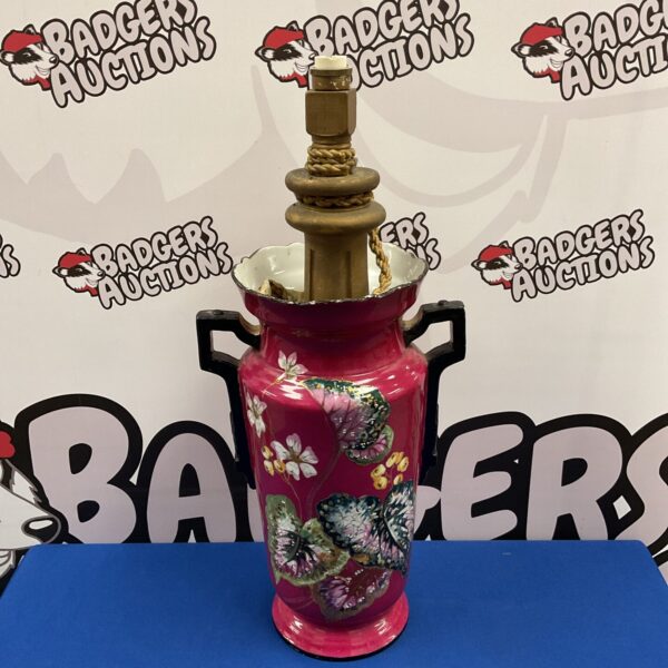 Vibrant oriental porcelain table lamp with intricate detailing.