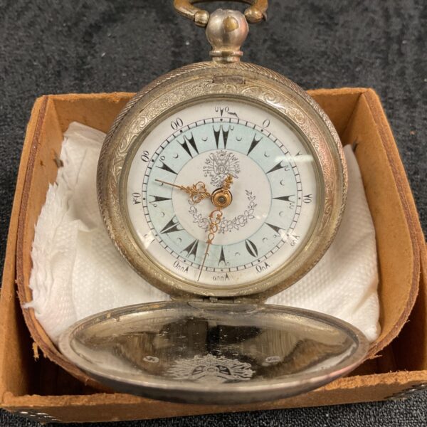 Antique Ottoman pocket watch with Turkish numerals on the dial.