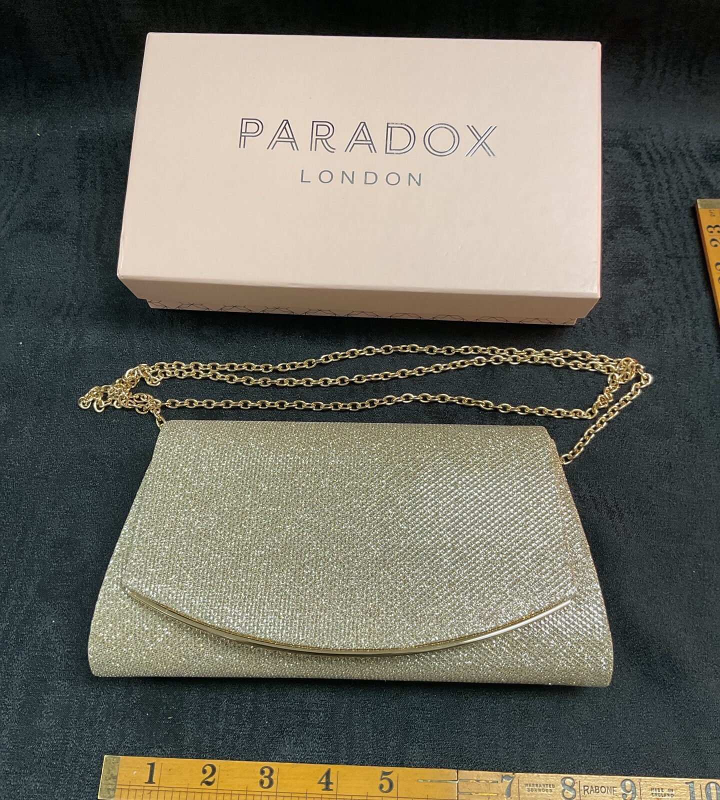 Silver beaded Paradox London clutch bag in original box.