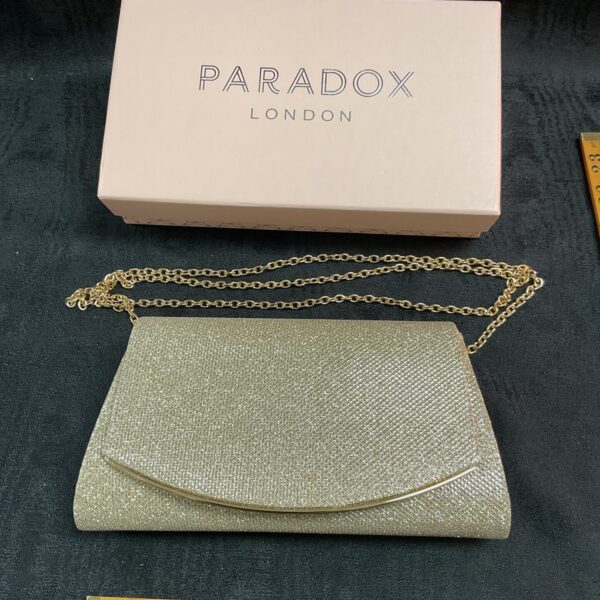 Silver beaded Paradox London clutch bag in original box.
