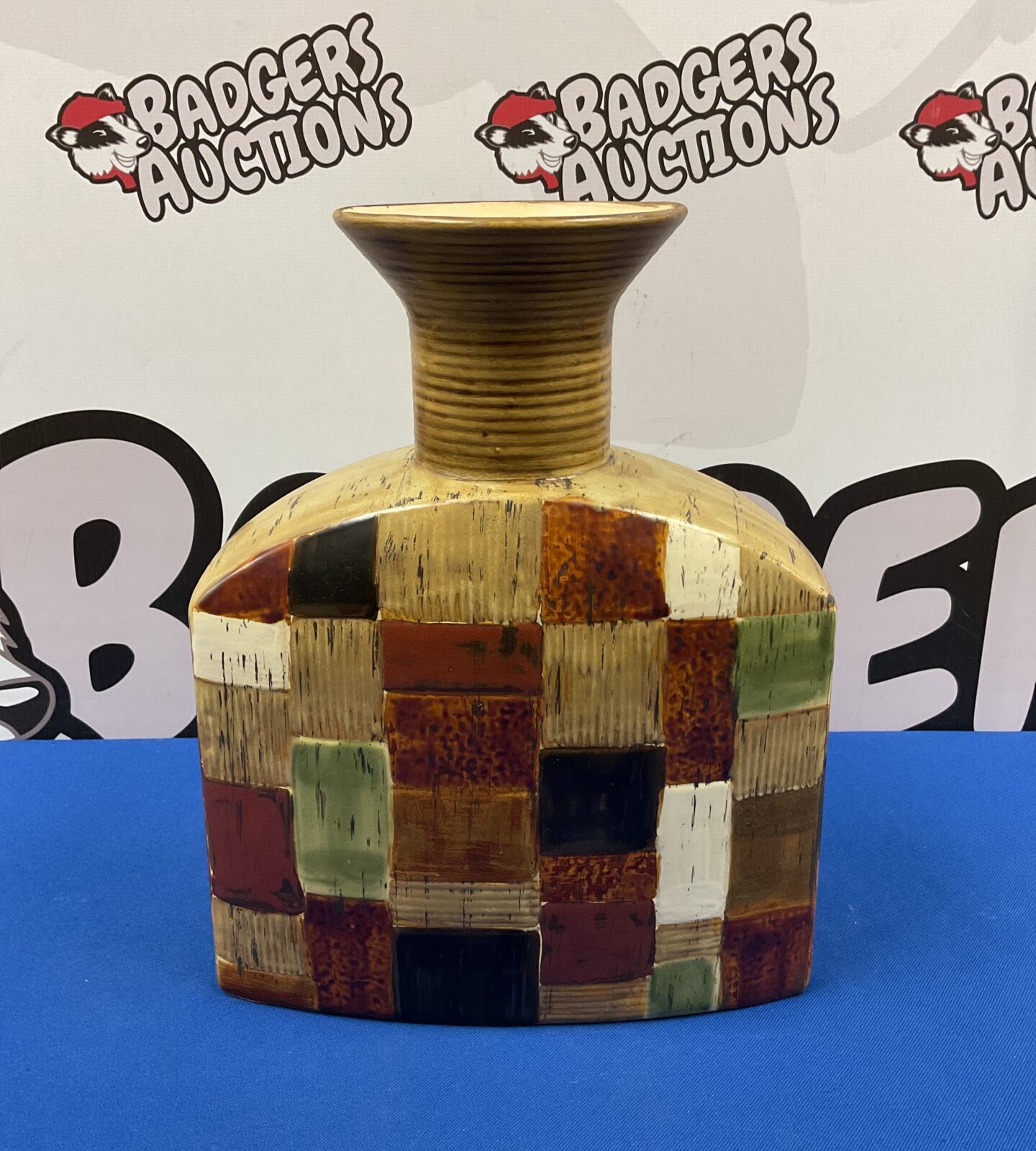 Colourful patchwork pottery vase, mid-century ceramic design.