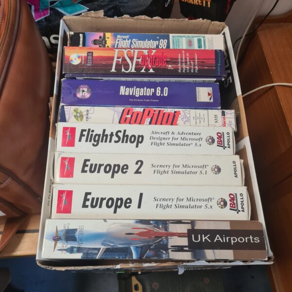Mixed lot of vintage PC games including flight simulator software.