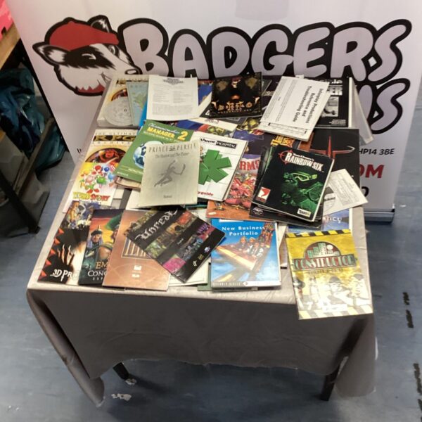 Lot of vintage PC gaming manuals and discs for collectors.