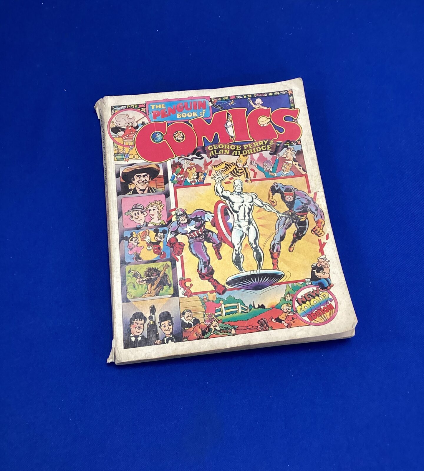 Vintage Penguin Book of Comics cover illustration by Alan Aldridge.