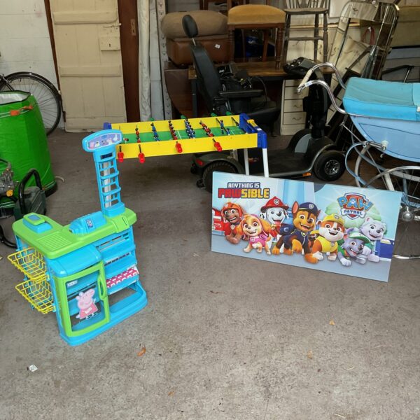 Colourful Peppa Pig play kitchen with football table and Paw Patrol canvas.