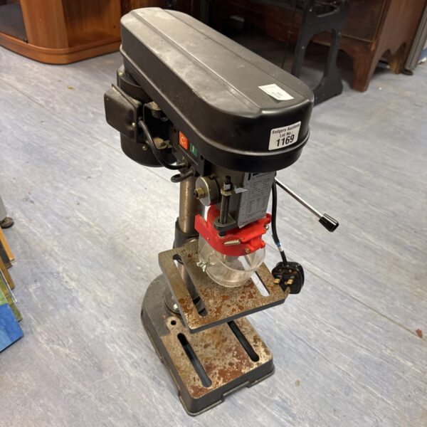 Front view of a Performance Pro pillar drill in a workshop setting.