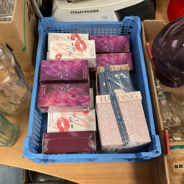 Boxed perfume lot including Sinful fragrance, assorted scents.