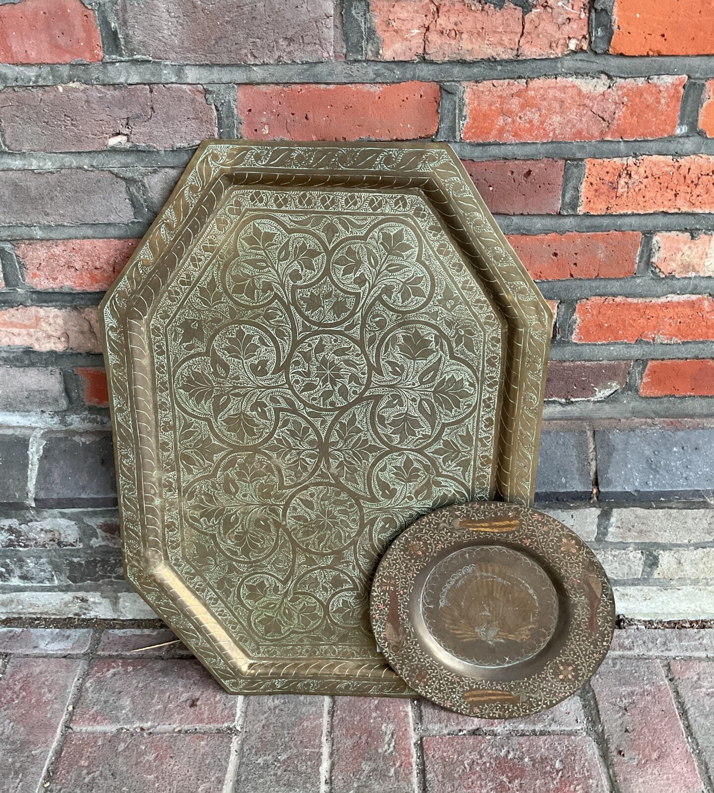 Antique Persian brass charger plate and copper peacock plate set.