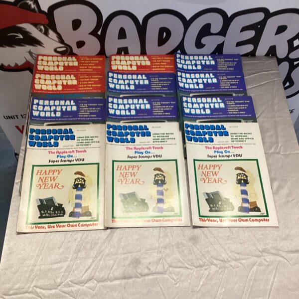 Bundle of vintage Personal Computer World magazines from the 1980s.
