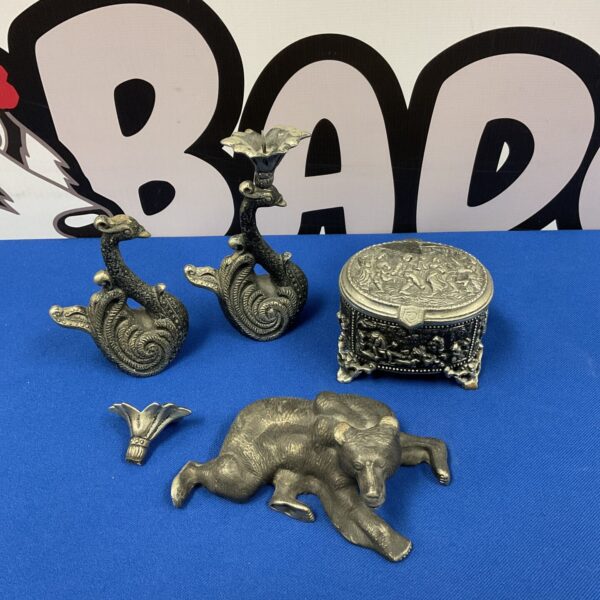 Vintage pewter bear figurine and trinket pot on display.