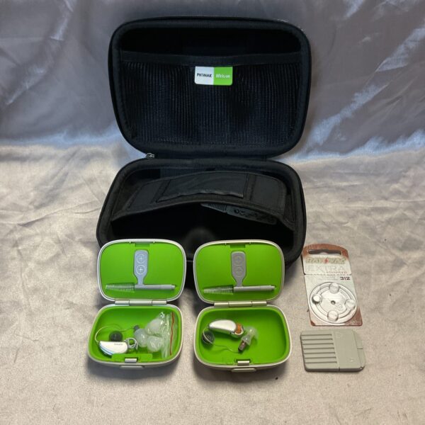 Two sets of Phonak hearing aids inside a protective case.