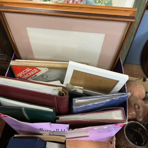Vintage photo album lot with various frames for memory keeping.
