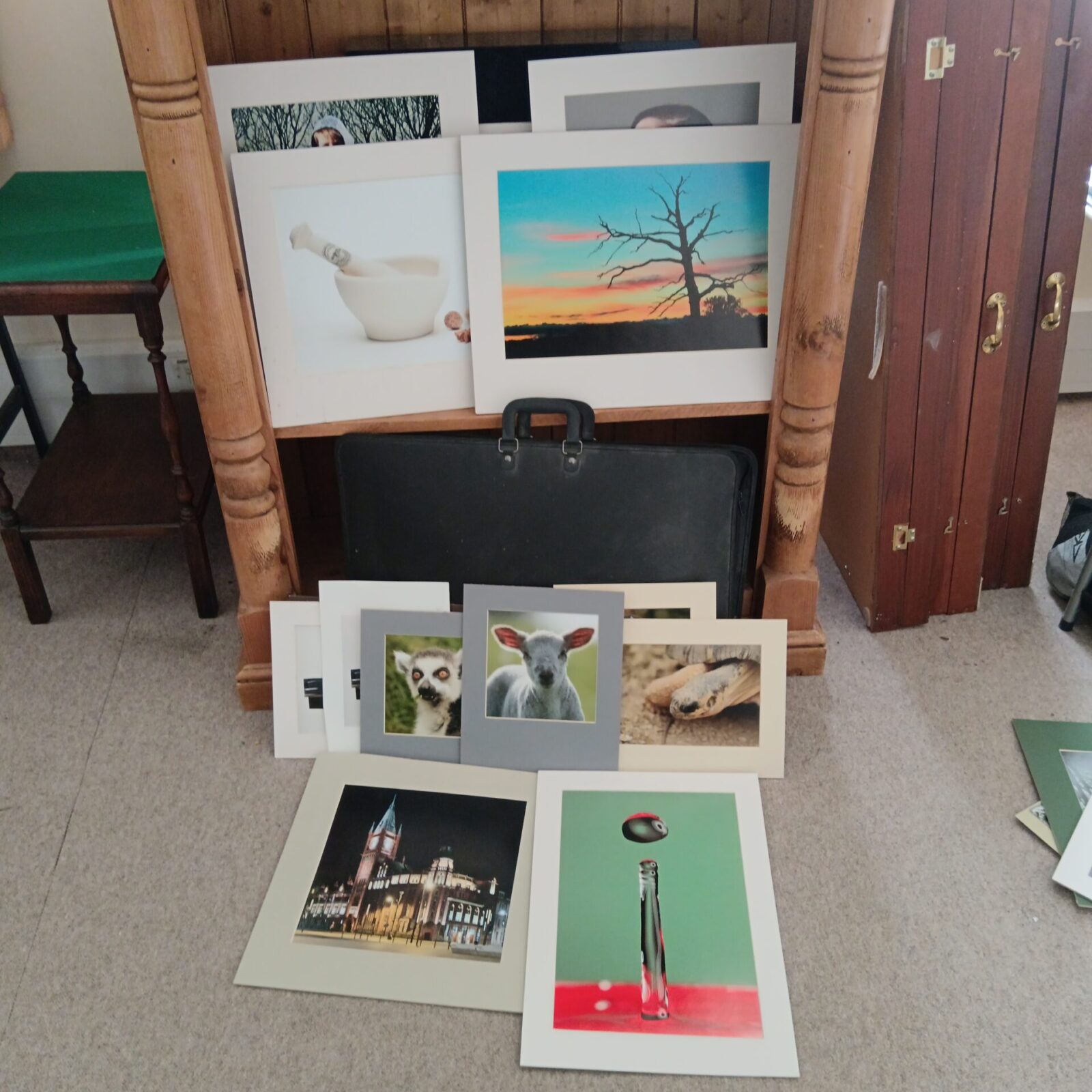 Vintage art case filled with a collection of photograph prints.
