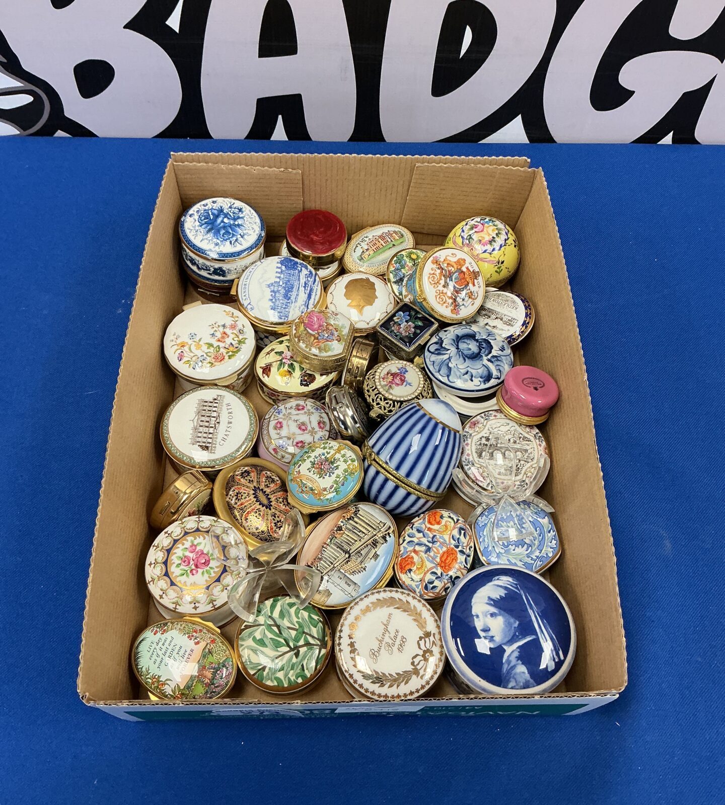Large collection of vintage and Aynsley pill boxes with floral designs.
