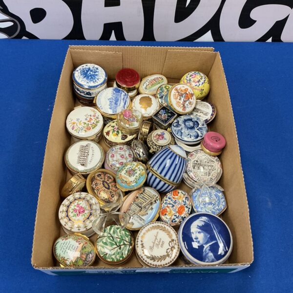 Large collection of vintage and Aynsley pill boxes with floral designs.