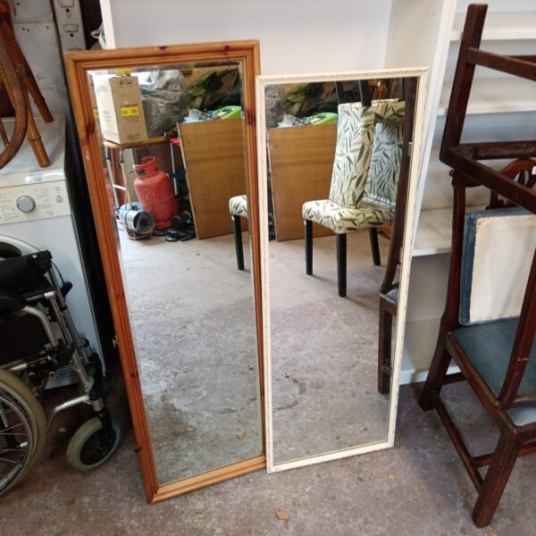 Vintage pine framed mirror for full-length reflections.